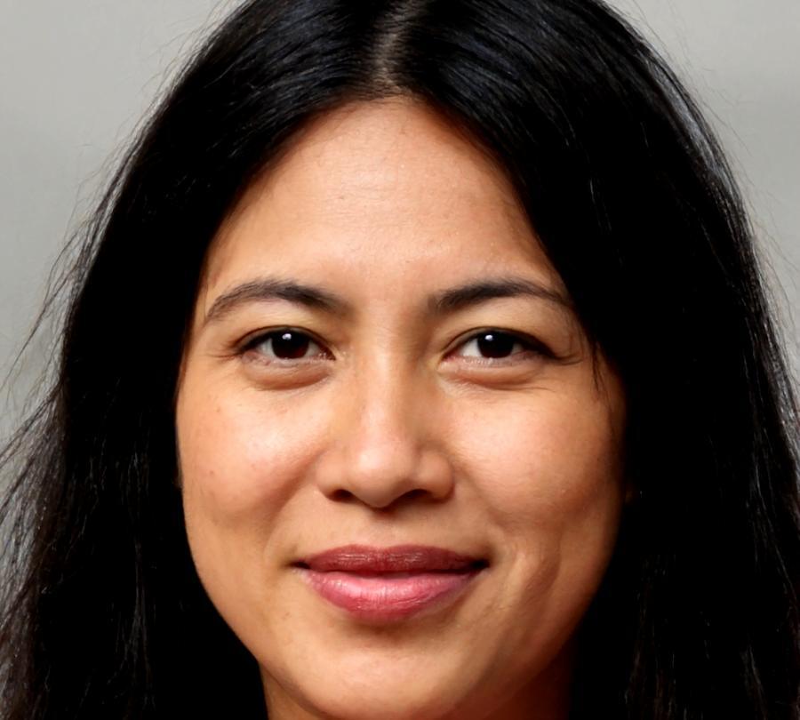 Senior financial analyst reviewing market data and client portfolios